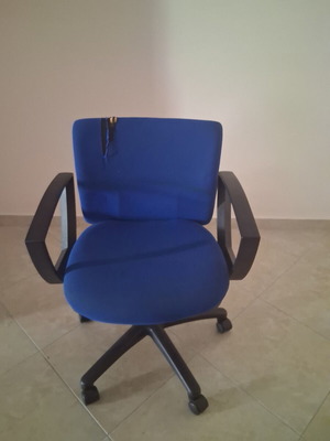 Office chair with fabric defect