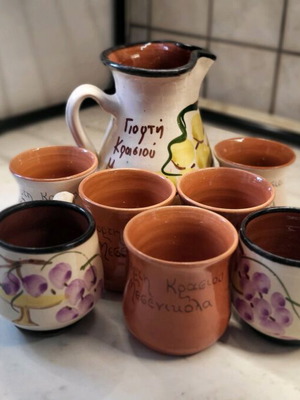 Wine carafe set with five glasses and two coffee cups made of clay like new