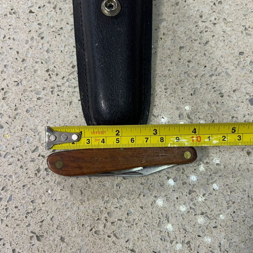 Folding knife used from 1980s with sheath