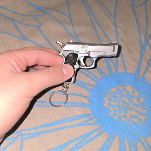 Lazer flashlight keychain in gun shape like new