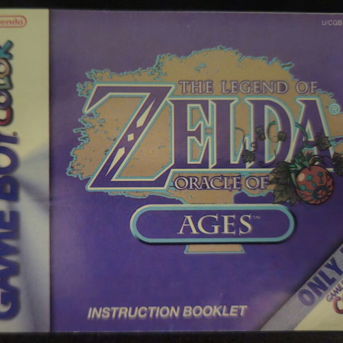 The Legend of Zelda Oracle of Ages Game Boy Color cartridge and manual