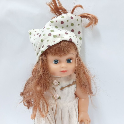 Vintage plastic doll 60s with open eyes, white knitted dress, tiara