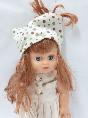 Vintage plastic doll 60s with open eyes, white knitted dress, tiara