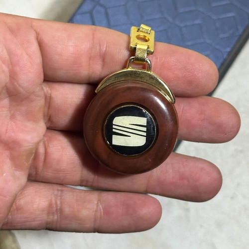 Vintage SEAT keychain used, bakelite with metal details