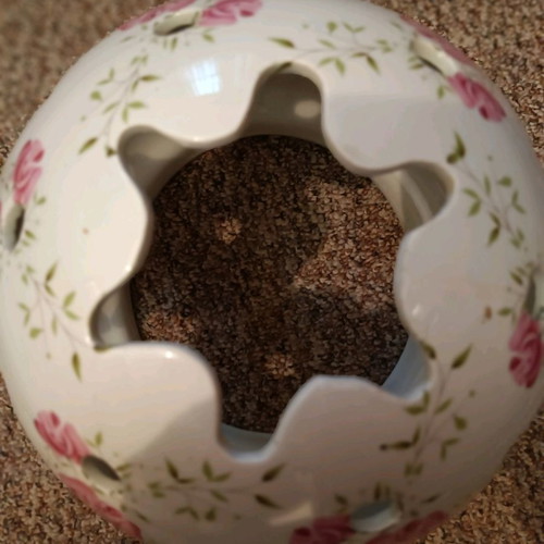 Ceramic lamp shade used with decorative design