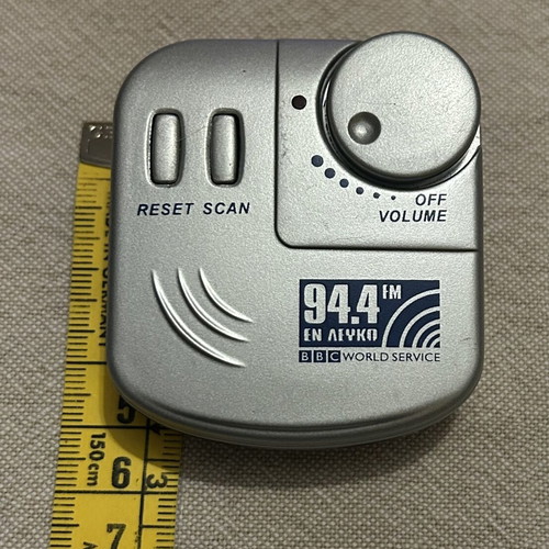 Pocket Radio with Headphones like new, silver color