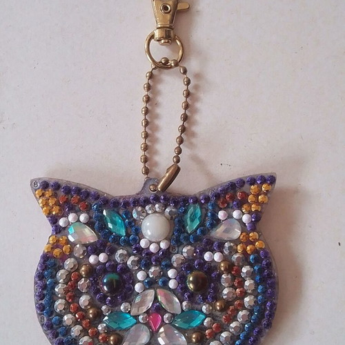 Cat-shaped double-sided keychain charm like new