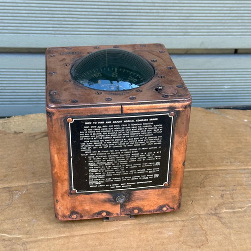Old copper submarine compass used with artificial horizon