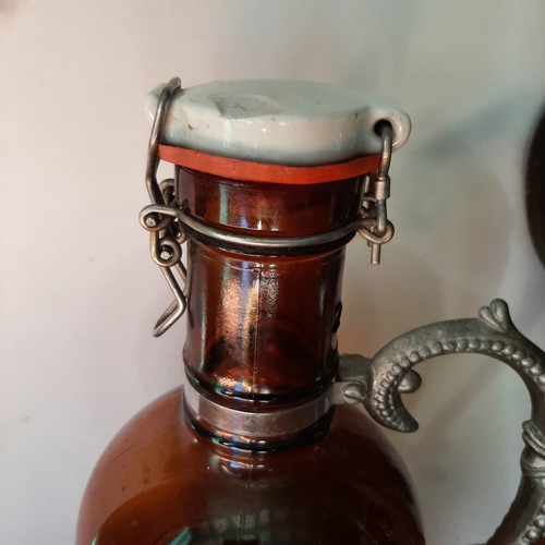 German vintage beer bottle growler with metal handle