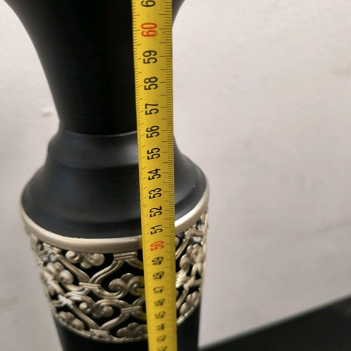 Metal vase in black color with bronze designs like new