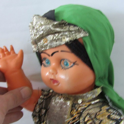 Vintage souvenir doll with traditional oriental costume used