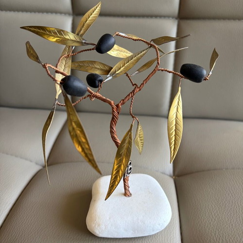 Handmade olive decoration on marble base used