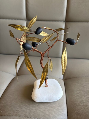 Handmade olive decoration on marble base used