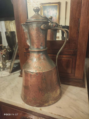 Copper jug used with hammered texture and lid