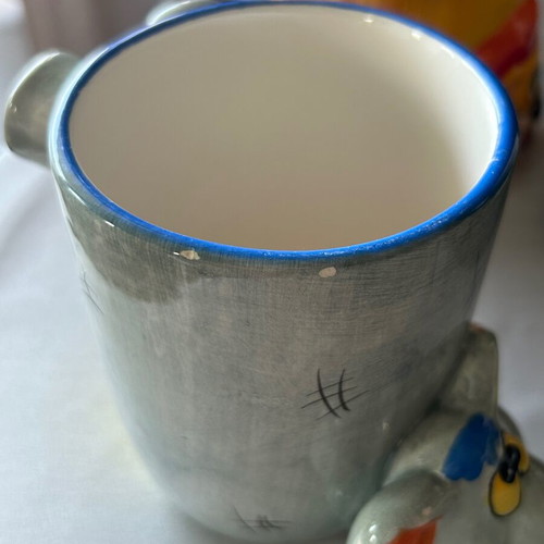 Children's ceramic mugs used, vintage with embossed elephant and lion