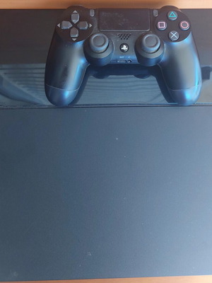 Sony PlayStation 4 1TB console with controller and 2 games