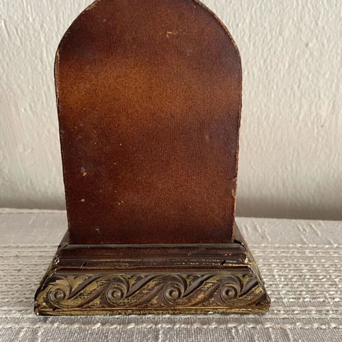 Vintage tabletop clock used, leather and carved wood