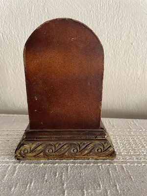 Vintage tabletop clock used, leather and carved wood