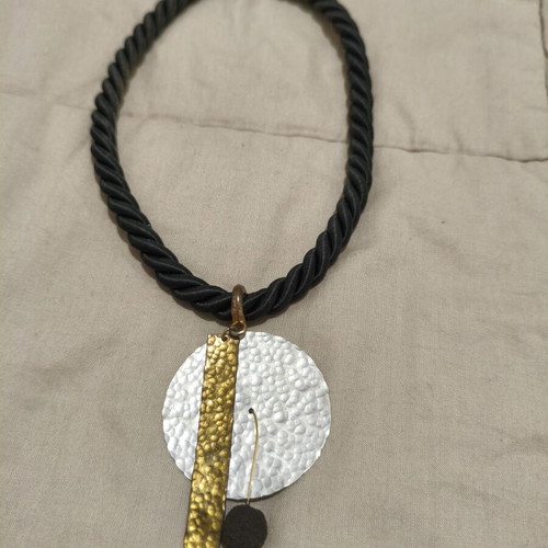 Statement handmade necklace with black rope and hammered metal elements like new