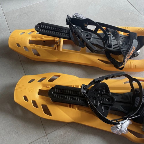 Sneka snowshoes used for hiking with metal crampons