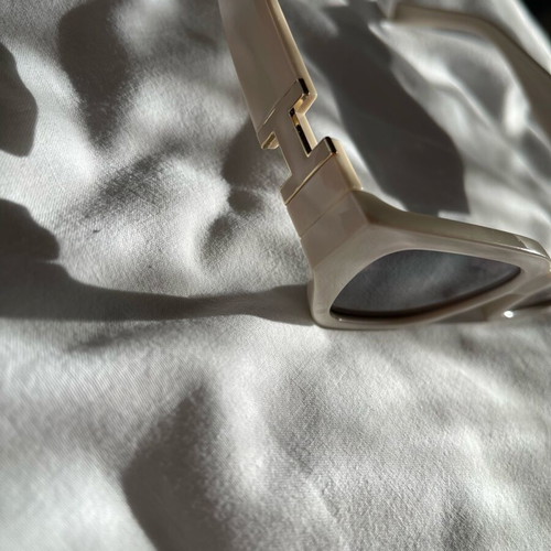 Sunglasses new, beige with metal decoration