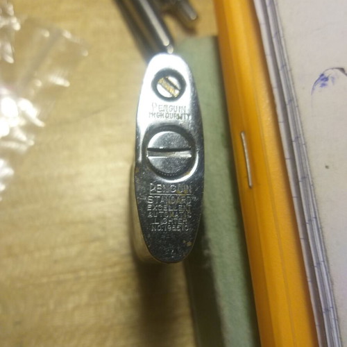 Penguin petrol lighter used, collectible