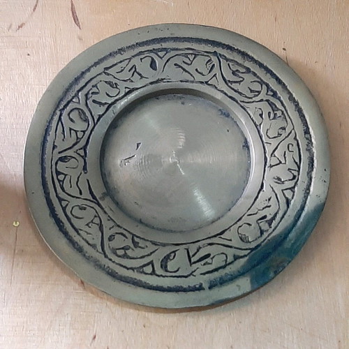 Oriental solid brass pitcher used with saucer