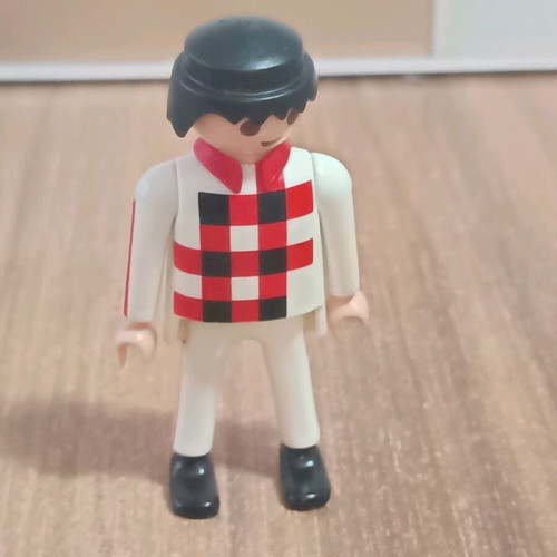 Playmobil figure with white outfit and checkered pattern like new