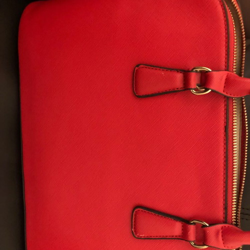 Red handbag used with wear marks