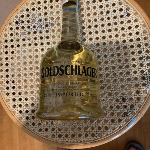 Goldschlager bottle like new with gold leaf bits collectible