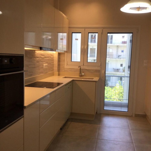 Modern kitchen with quartz countertop and granite undermount sink like new, beige lacquer