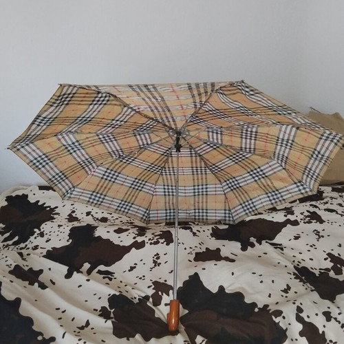 Vintage unisex folding umbrella with wooden handle, used