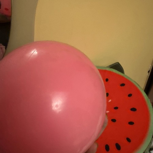 Pink inflatable beach ball with dolphin design