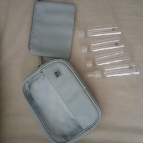 Travel toiletry bag like new with four 100ml containers and small pouch