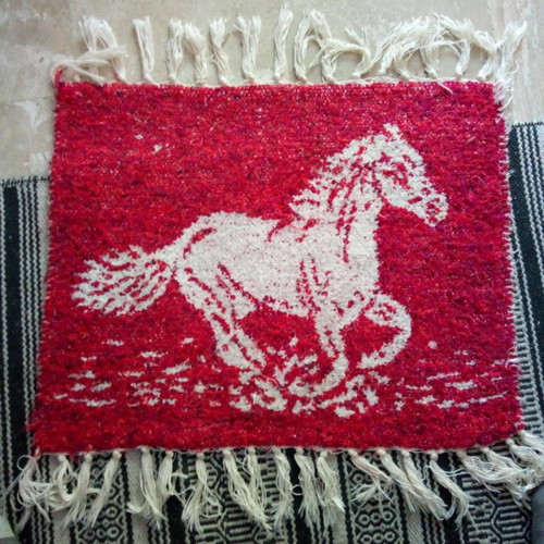 Red rug with white horse design like new, handmade
