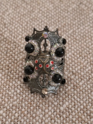 Long ring used, black and silver