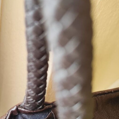 Brown handbag used, faux leather with damages near zipper