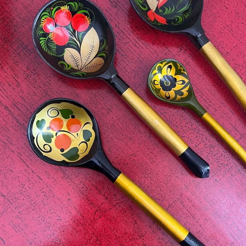 Decorative spoons used, set of 4 wooden with folk motifs