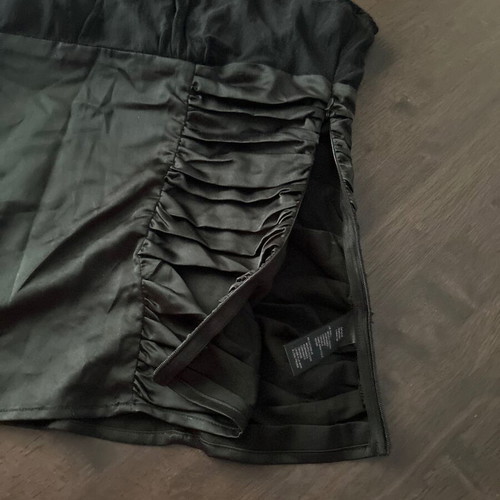 Twentyone L, women's black blouse, made of satin and muslin. The bow at the back.