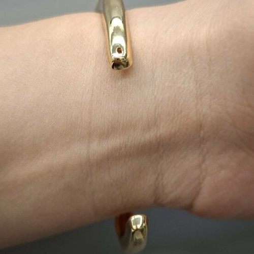 Gold-tone metal cuff bracelet, minimal design