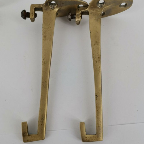 Pair of brass curtain hooks with clamp used