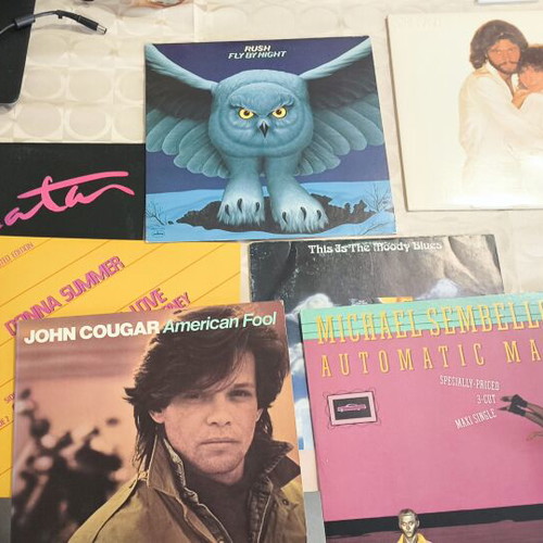 Vinyl records used, pack of about 75 with classic rock artists
