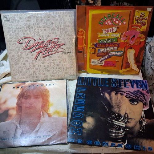 4 LPs from 80s and 90s like new, with one free