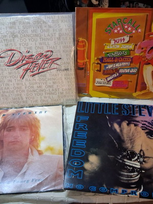 4 LPs from 80s and 90s like new, with one free