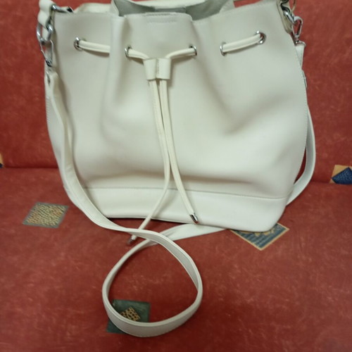 Beige drawstring crossbody bag like new with inner pocket