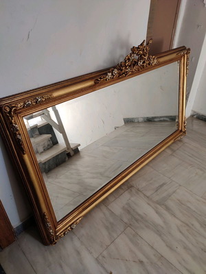 Carved mirror in gold color like new