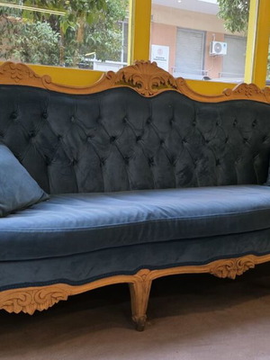Vintage sofa reconstruction with wood details like new