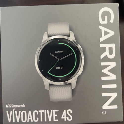 Garmin Vivoactive 4s smartwatch with charger and two straps