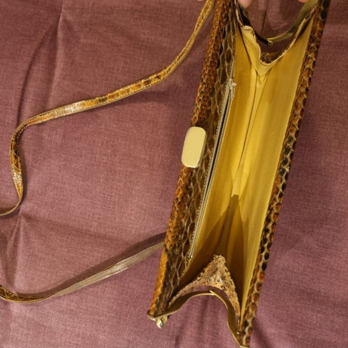 Crossbody bag used with python print leather pattern