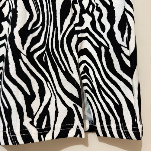 Mini skirt with animal print and front slit by Shein, like new